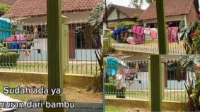 [VIDEO] Wanita kesal jiran seberang jalan, buat pagar rumahnya jadi ampaian